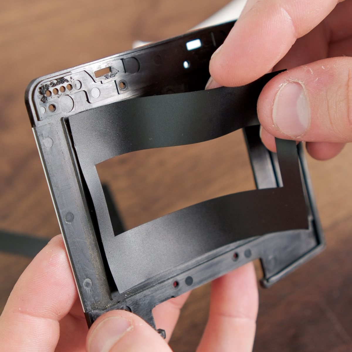 Custom panoramic gate mask being positioned inside a Mamiya 645 Pro film gate