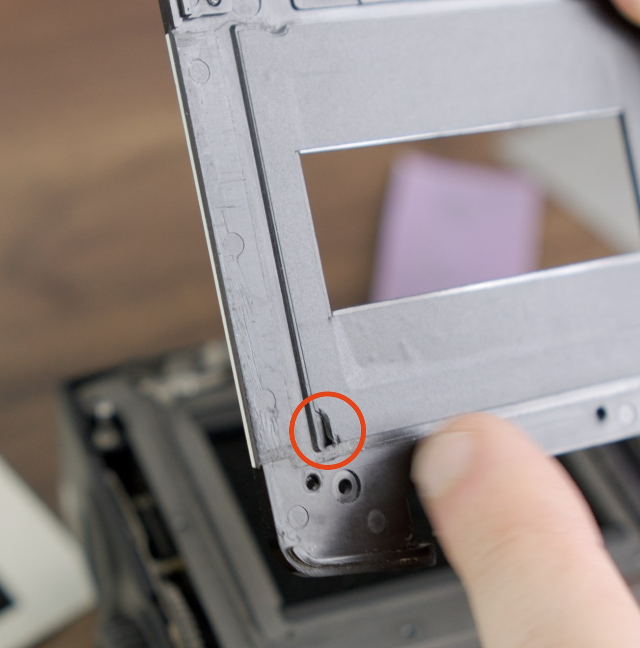 Darkslide-side vinyl interference point circled on the back of the front panel.