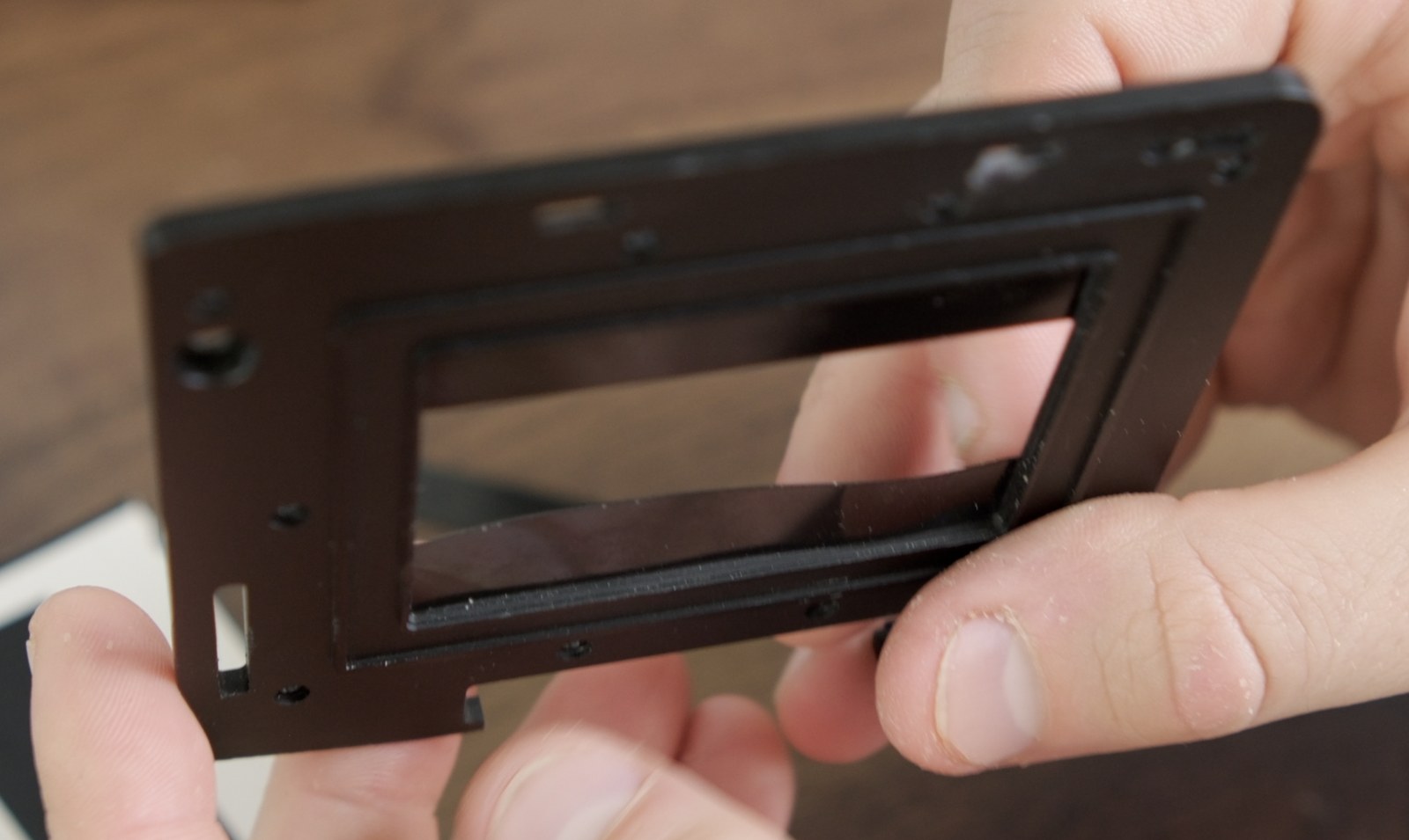 PET masking strip bowing because it is slightly oversized.