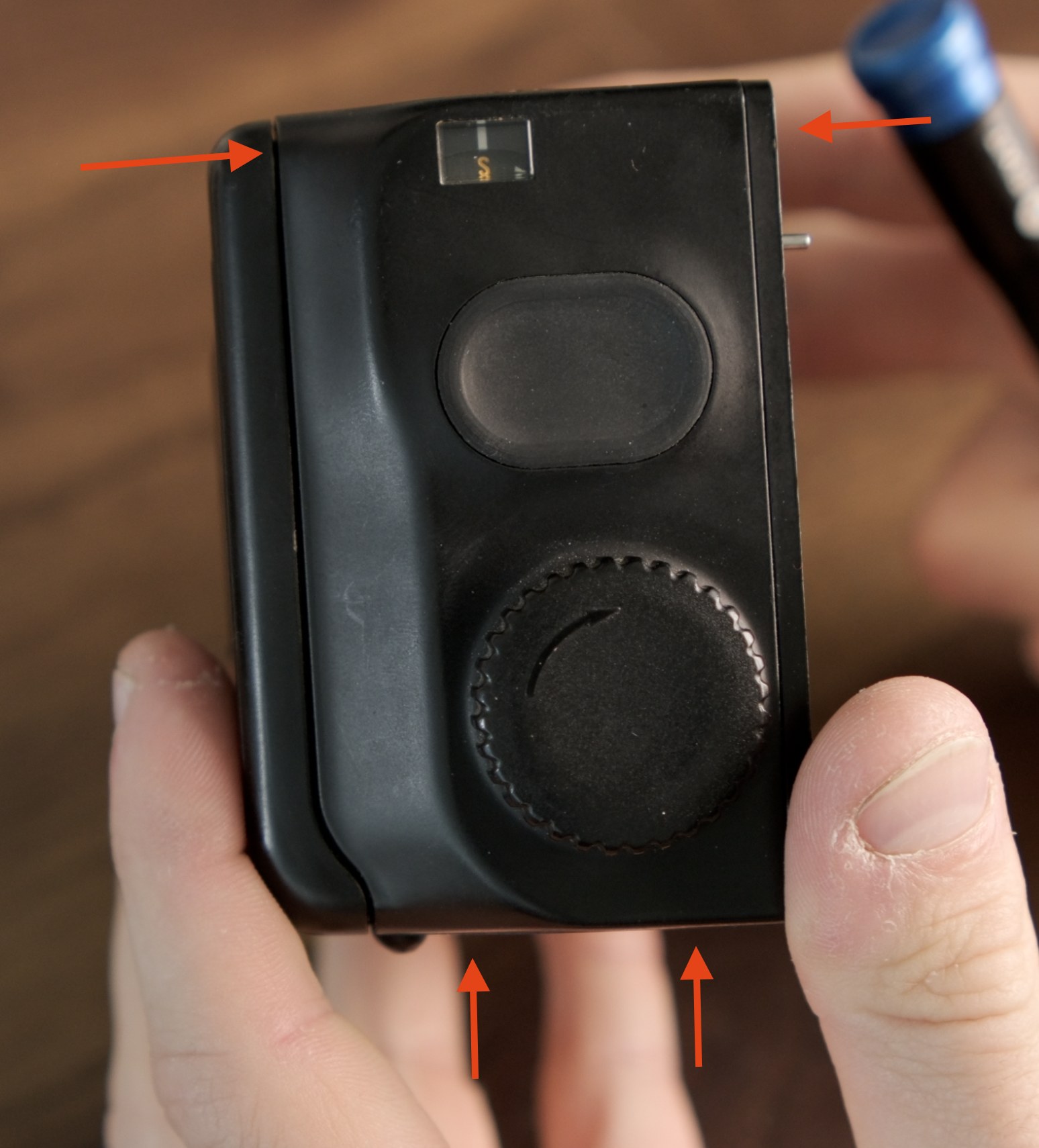 Right side panel of the film back with the first screws indicated.