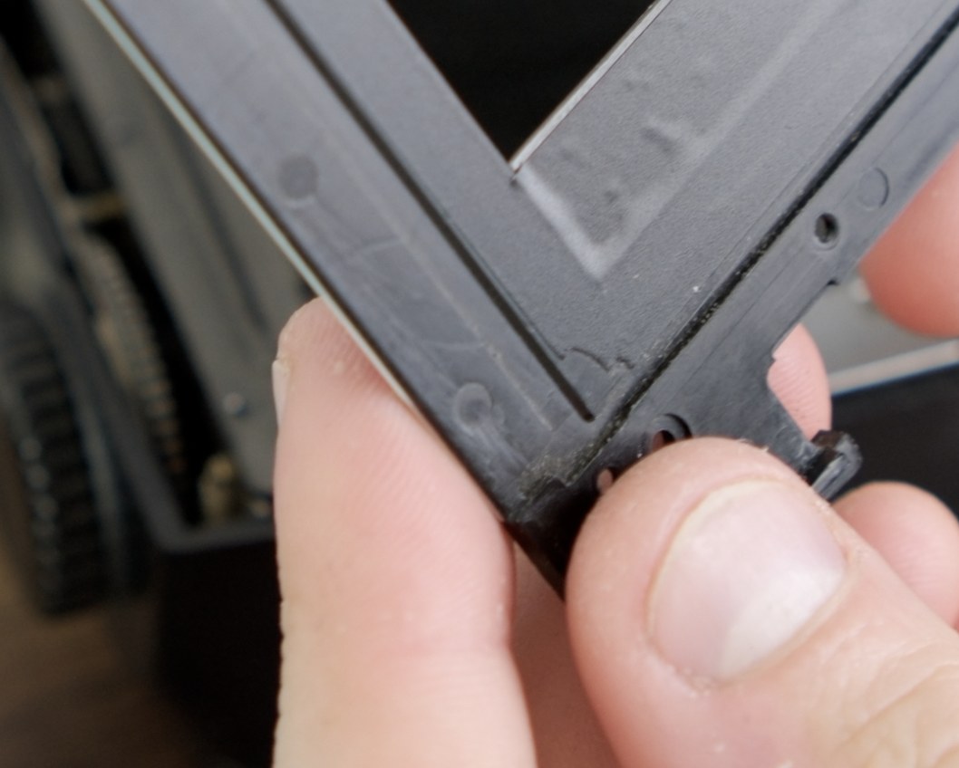 Close-up of the darkslide-side vinyl edge after trimming.